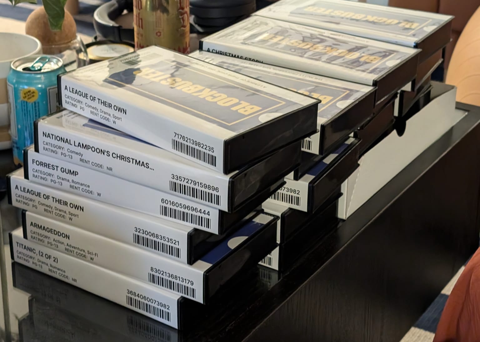 The finished Blockbuster clamshells stacked on a desk